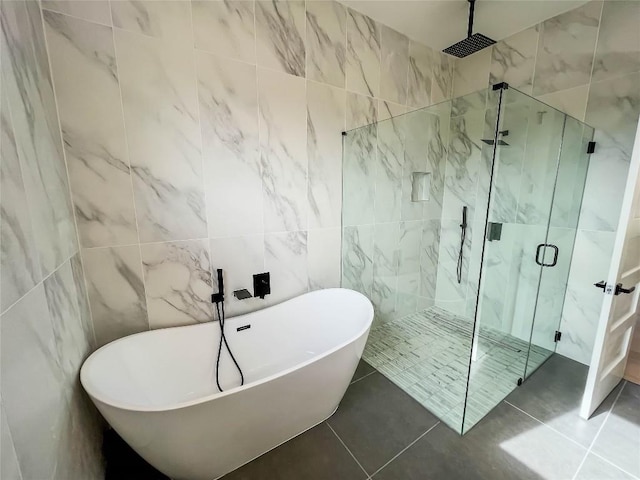 1020 Mountain Leather Dr, Horseshoe Bay, TX 78657 - full bath featuring tile walls, a shower stall, a soaking tub, and tile patterned flooring