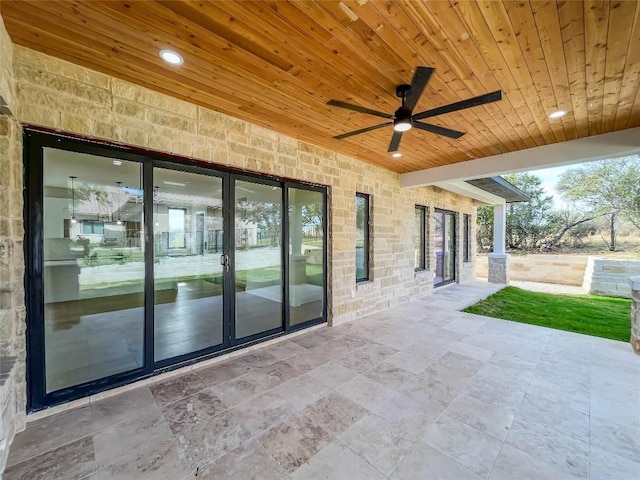 view of patio featuring ceiling fan