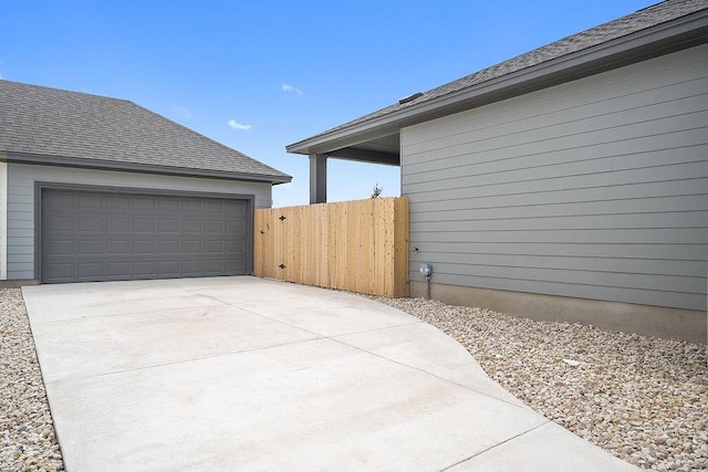 137 Tenny Ln, Kyle, TX 78640 - view of side of home featuring a garage and fence