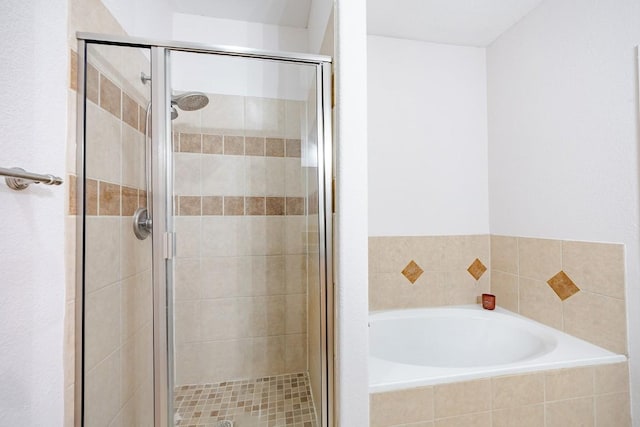 bathroom with separate shower and tub