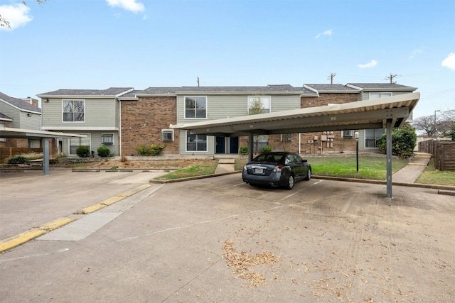2018 W Rundberg Ln Unit 9D, Austin, TX 78758 - view of front facade with covered parking and brick siding
