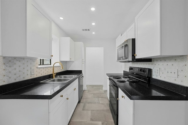 2018 W Rundberg Ln Unit 9D, Austin, TX 78758 - kitchen featuring stainless steel appliances, a sink, white cabinets, dark countertops, and recessed lighting