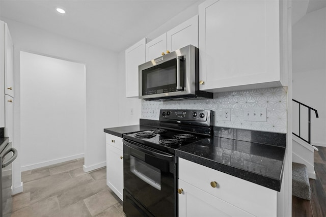2018 W Rundberg Ln Unit 9D, Austin, TX 78758 - kitchen featuring black range with electric cooktop, stainless steel microwave, white cabinets, dark countertops, and decorative backsplash