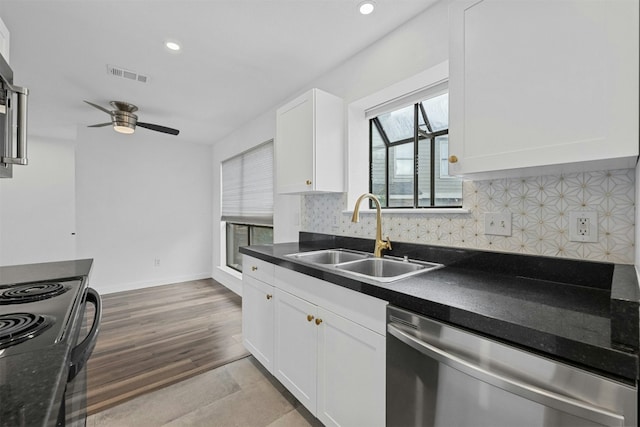 2018 W Rundberg Ln Unit 9D, Austin, TX 78758 - kitchen featuring a sink, dishwasher, dark countertops, white cabinets, and backsplash