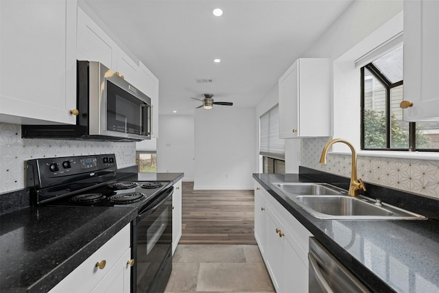 2018 W Rundberg Ln Unit 9D, Austin, TX 78758 - kitchen featuring appliances with stainless steel finishes, a sink, white cabinets, recessed lighting, and a ceiling fan
