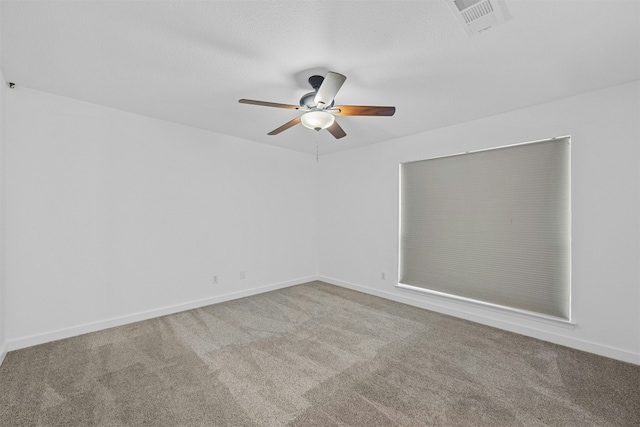 2018 W Rundberg Ln Unit 9D, Austin, TX 78758 - carpeted empty room featuring a ceiling fan and baseboards