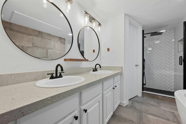 2018 W Rundberg Ln Unit 9D, Austin, TX 78758 - bathroom with double vanity, a shower stall, and a freestanding bath