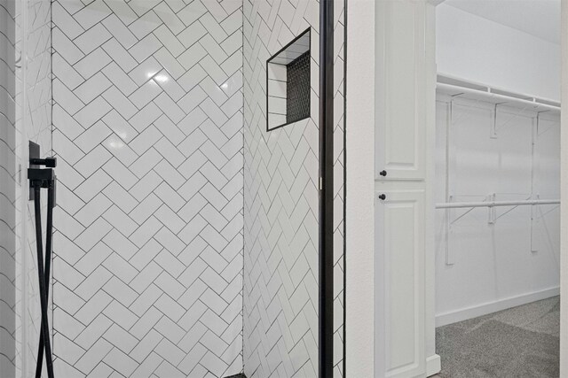 2018 W Rundberg Ln Unit 9D, Austin, TX 78758 - details with carpet flooring and a tile shower