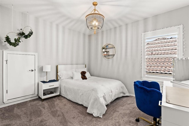 carpeted bedroom with a chandelier