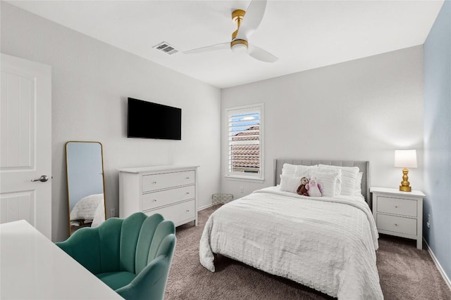 bedroom featuring ceiling fan and dark carpet