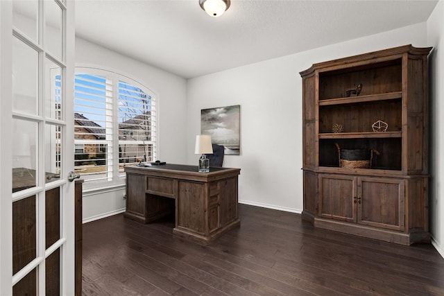 office area with dark wood-type flooring and plenty of natural light