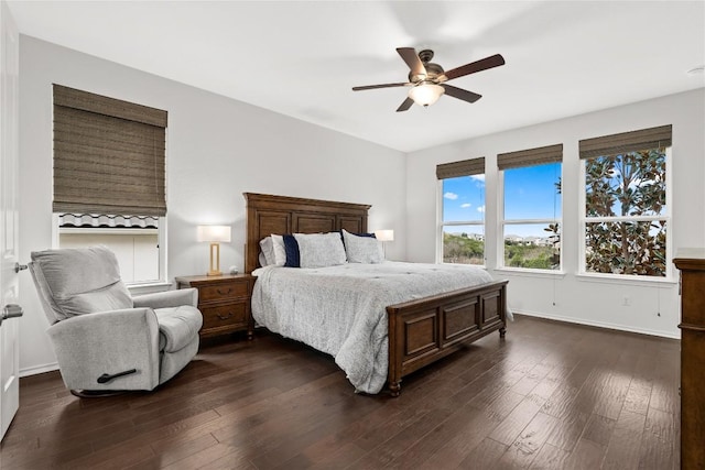 bedroom with dark wood-type flooring and ceiling fan