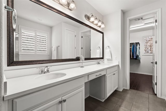 bathroom with vanity and tile patterned floors