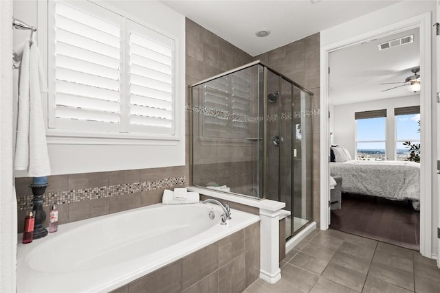 bathroom featuring plus walk in shower, tile patterned floors, and ceiling fan