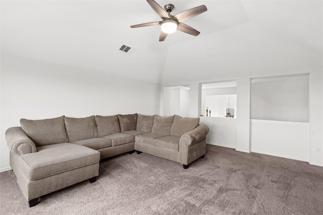 living room with lofted ceiling, ceiling fan, and carpet