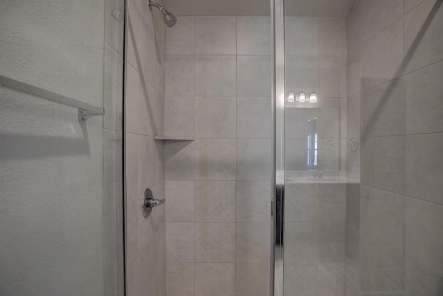 full bathroom featuring a shower stall