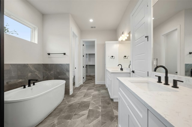 bathroom featuring vanity and a bathtub