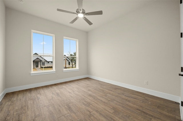 spare room featuring hardwood / wood-style flooring and ceiling fan