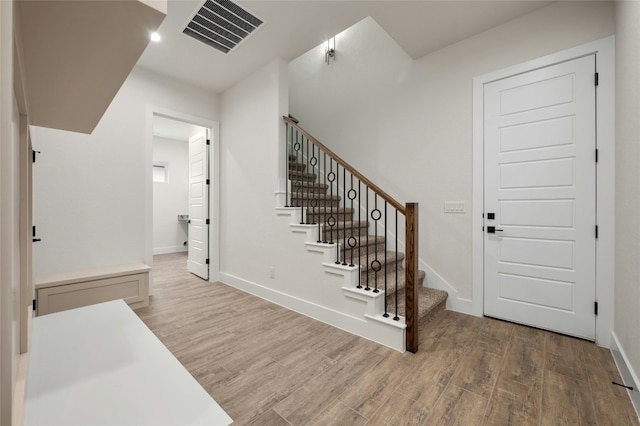 entrance foyer with hardwood / wood-style floors