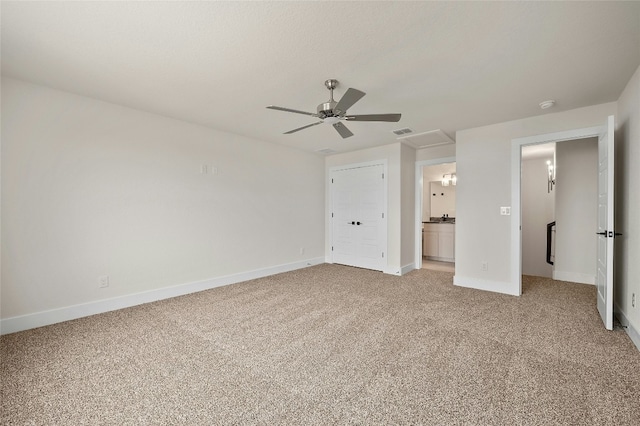 unfurnished bedroom with light carpet, connected bathroom, and ceiling fan