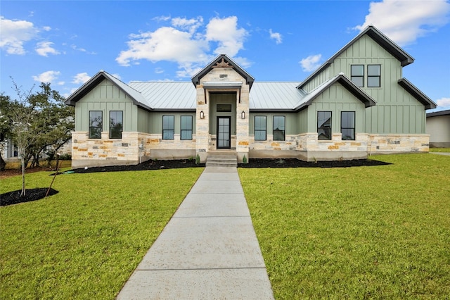 modern inspired farmhouse with stone siding, board and batten siding, and a standing seam roof