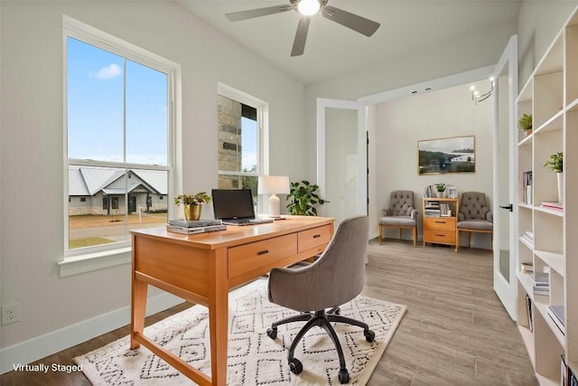 office area with hardwood / wood-style floors and ceiling fan