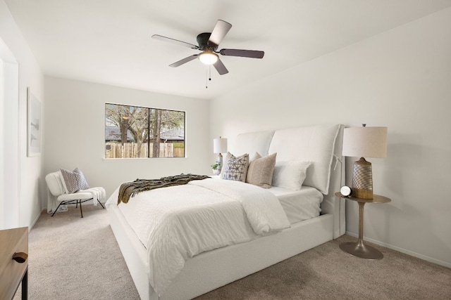 bedroom featuring light colored carpet and ceiling fan