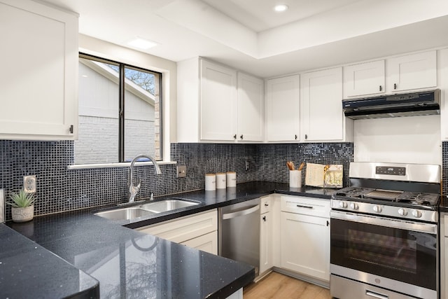 kitchen featuring white cabinetry, sink, decorative backsplash, and appliances with stainless steel finishes