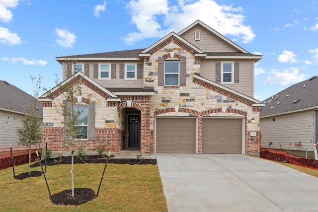 craftsman inspired home with a garage and a front lawn