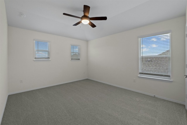 carpeted empty room with ceiling fan