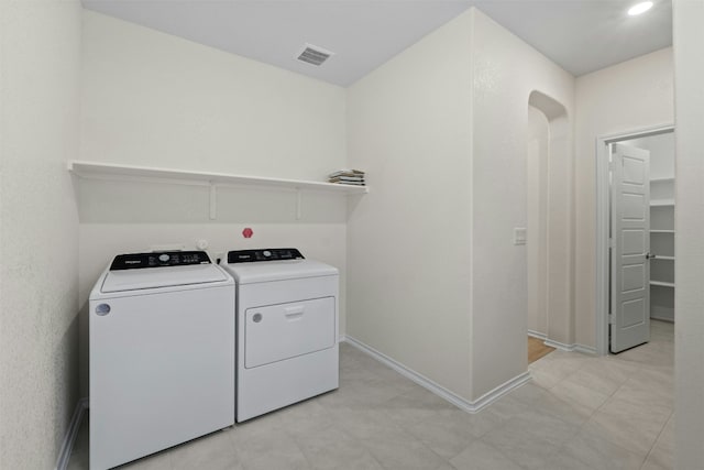 laundry room with washing machine and dryer