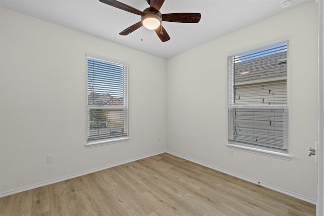 spare room with ceiling fan and light hardwood / wood-style floors