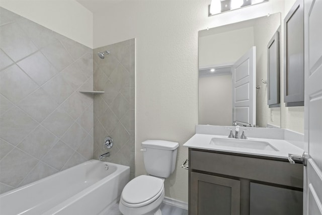 full bathroom with vanity, toilet, and tiled shower / bath combo