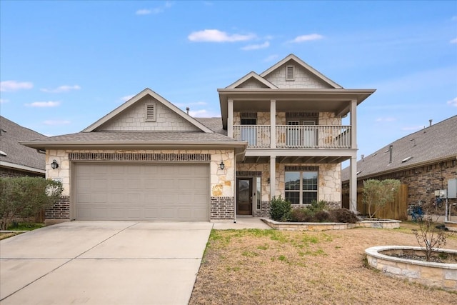 view of front of home featuring a garage and a balcony