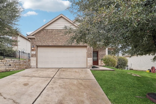 10017 Pinnacle Crest Loop, Austin, TX 78747 - view of front facade featuring brick siding, driveway, and an attached garage