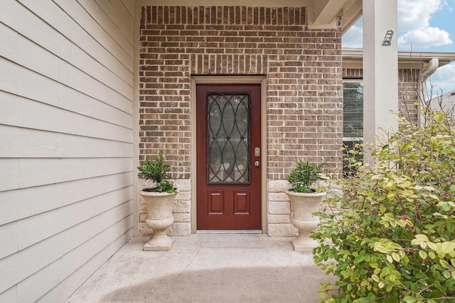 10017 Pinnacle Crest Loop, Austin, TX 78747 - doorway to property featuring brick siding