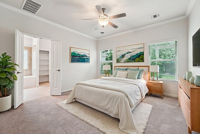 10017 Pinnacle Crest Loop, Austin, TX 78747 - bedroom with light colored carpet, baseboards, crown molding, a ceiling fan, and a walk in closet