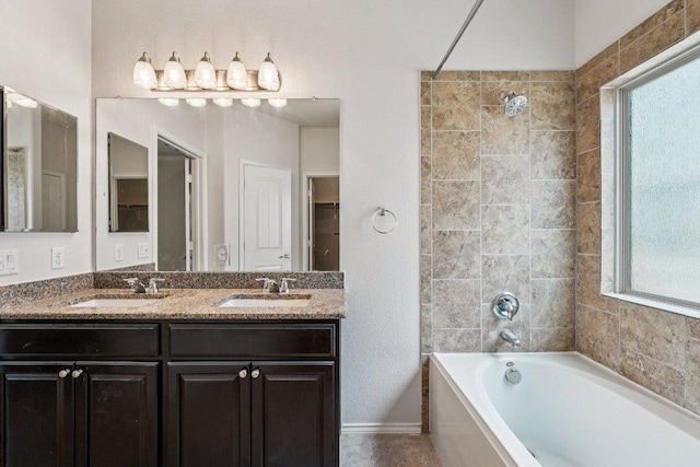 10017 Pinnacle Crest Loop, Austin, TX 78747 - bathroom with healthy amount of natural light, a tub to relax in, double vanity, and a shower