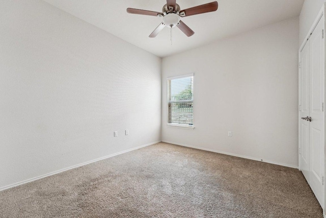 10017 Pinnacle Crest Loop, Austin, TX 78747 - unfurnished bedroom with carpet floors, baseboards, a ceiling fan, and a closet