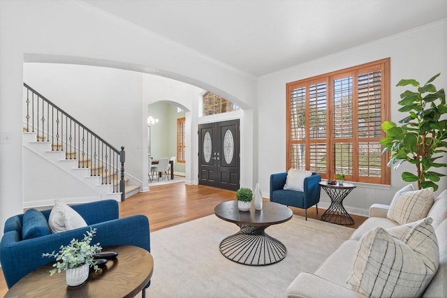 interior space featuring wood-type flooring and ornamental molding