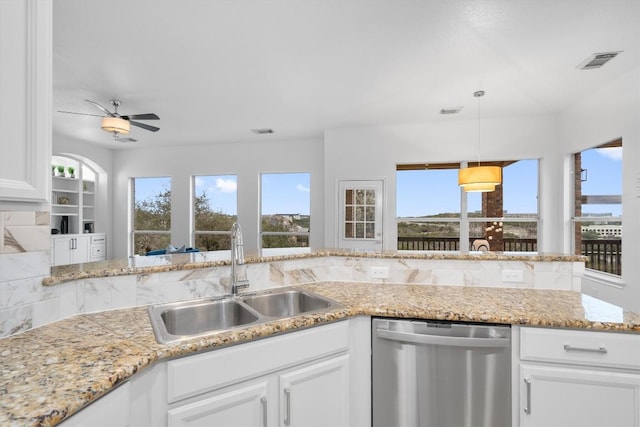 kitchen featuring decorative light fixtures, white cabinetry, sink, stainless steel dishwasher, and ceiling fan