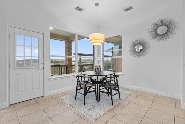 dining space with light tile patterned floors