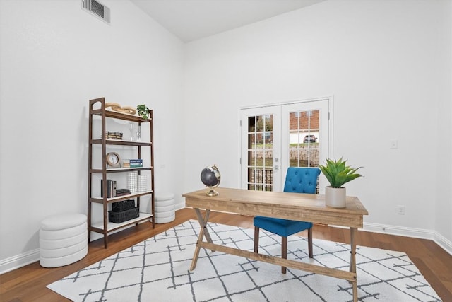 home office with french doors and wood-type flooring