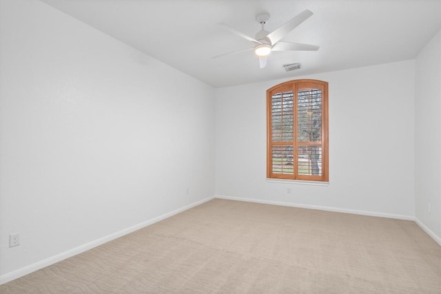 unfurnished room with light carpet and ceiling fan