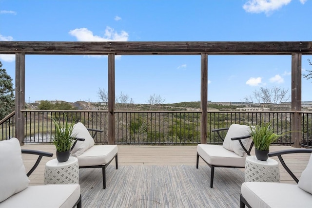 wooden deck with outdoor lounge area