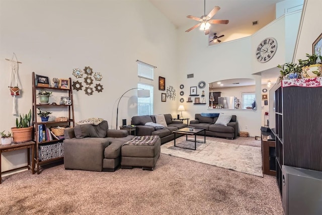 12828 Starbrimson Trl, Elgin, TX 78621 - living room featuring carpet floors, ceiling fan, and a towering ceiling
