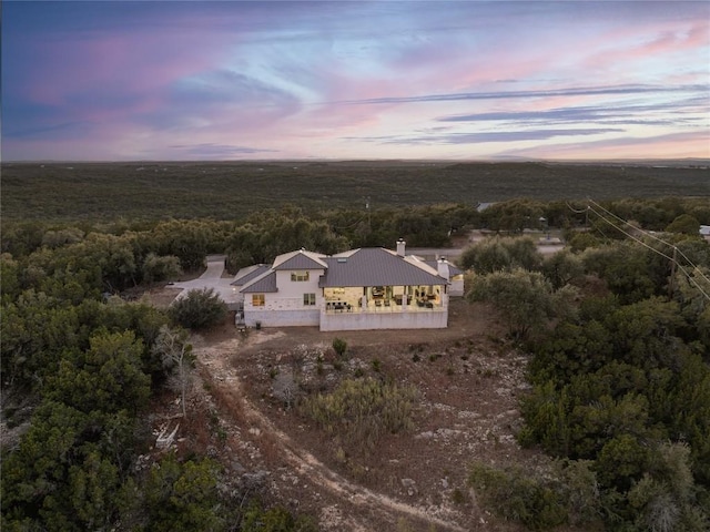 1821 Overland Stage Rd, Dripping Springs, TX 78620 - aerial view at dusk of a wooded view