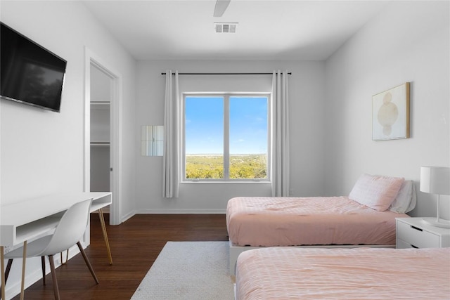 1821 Overland Stage Rd, Dripping Springs, TX 78620 - bedroom featuring dark wood finished floors, baseboards, and ceiling fan