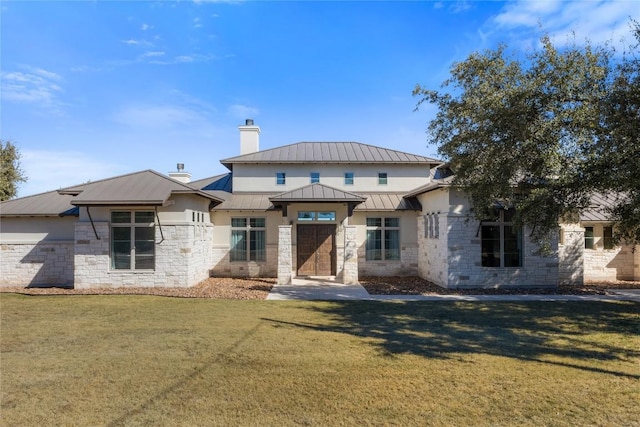 1821 Overland Stage Rd, Dripping Springs, TX 78620 - view of front facade with stone siding, a standing seam roof, a chimney, and a front yard