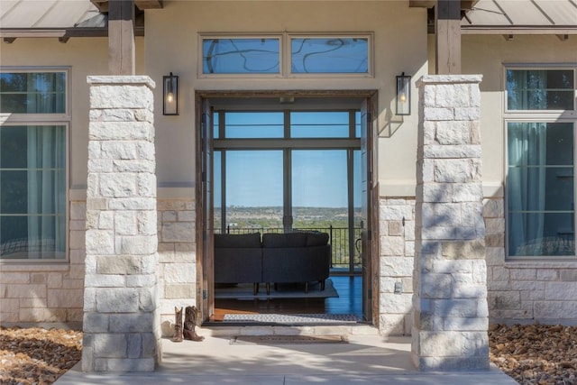 1821 Overland Stage Rd, Dripping Springs, TX 78620 - view of exterior entry with stone siding and stucco siding